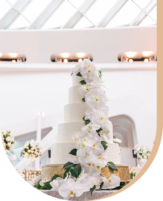 Four Tiered Wedding Cake with White Colored Flower